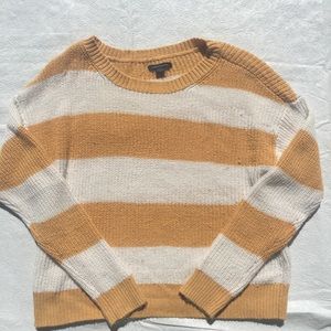 White and orange striped sweater